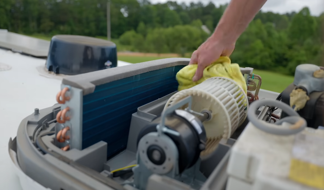 Close-up of RV AC capacitor being tested with a multimeter in Stuart FL